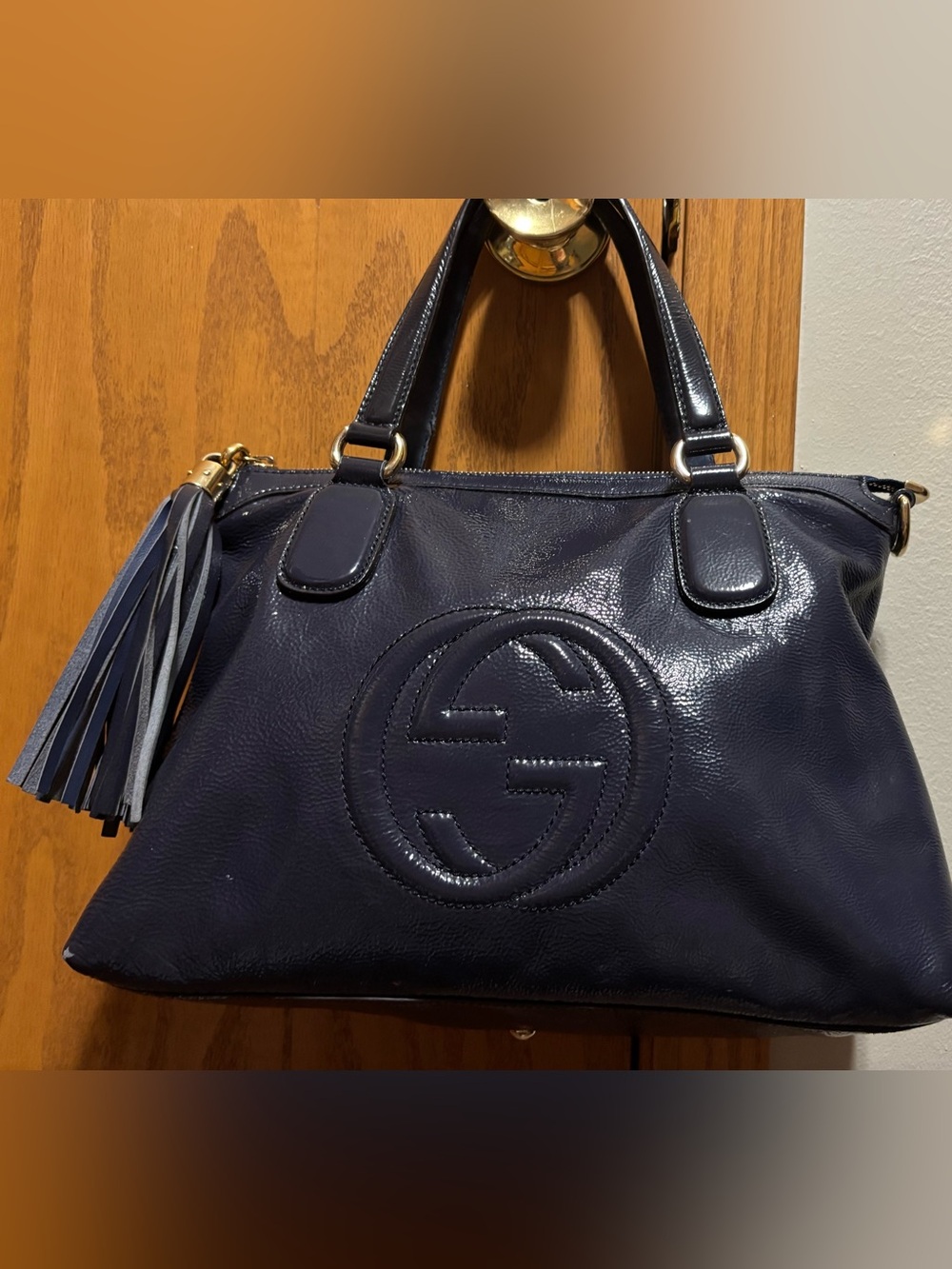 Gucci Dark Navy patent leather soho bag.